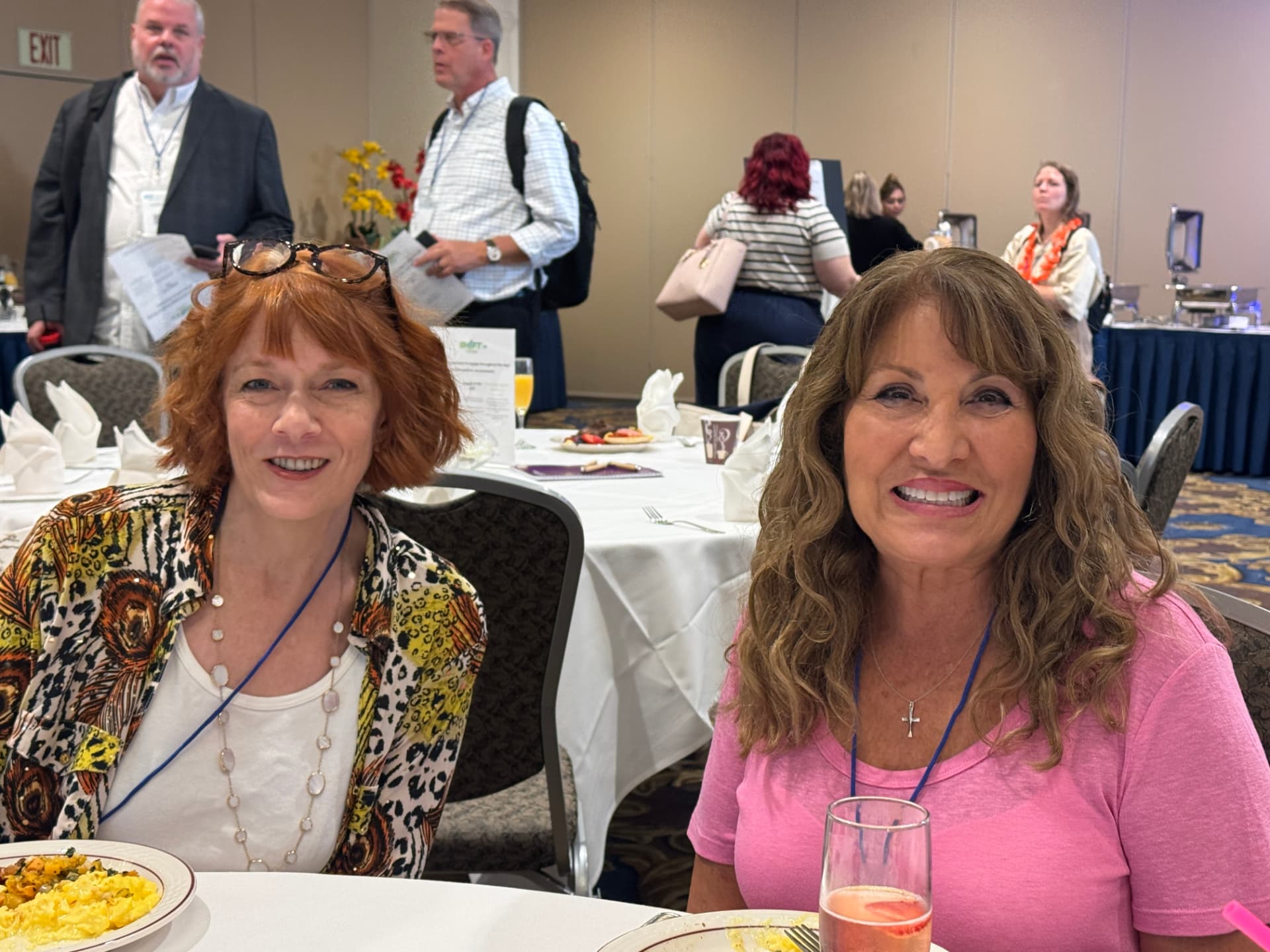 Two attendees smiling during the SHIFT 2026 morning session