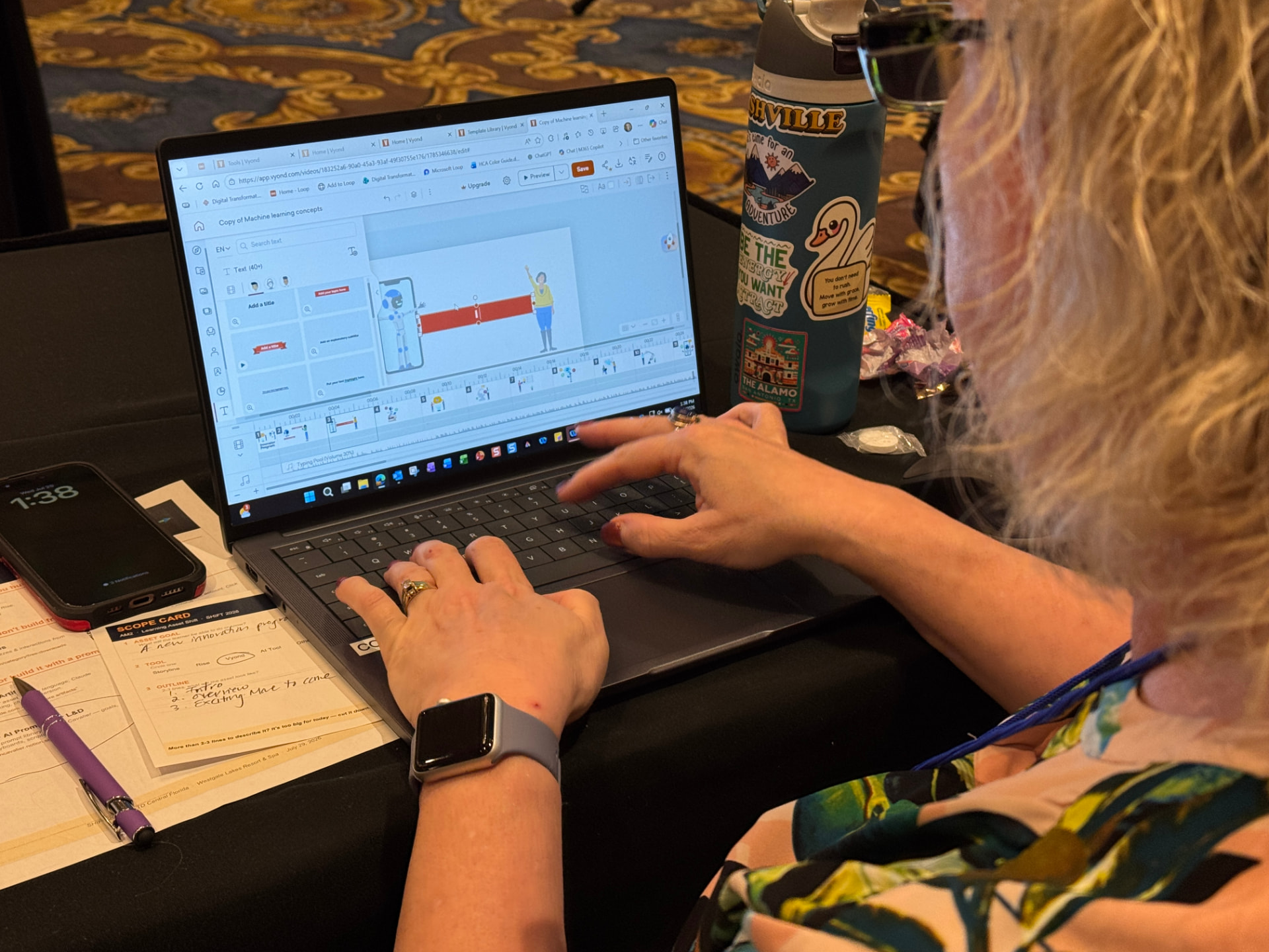 Attendee building a learning asset on a laptop during a build block