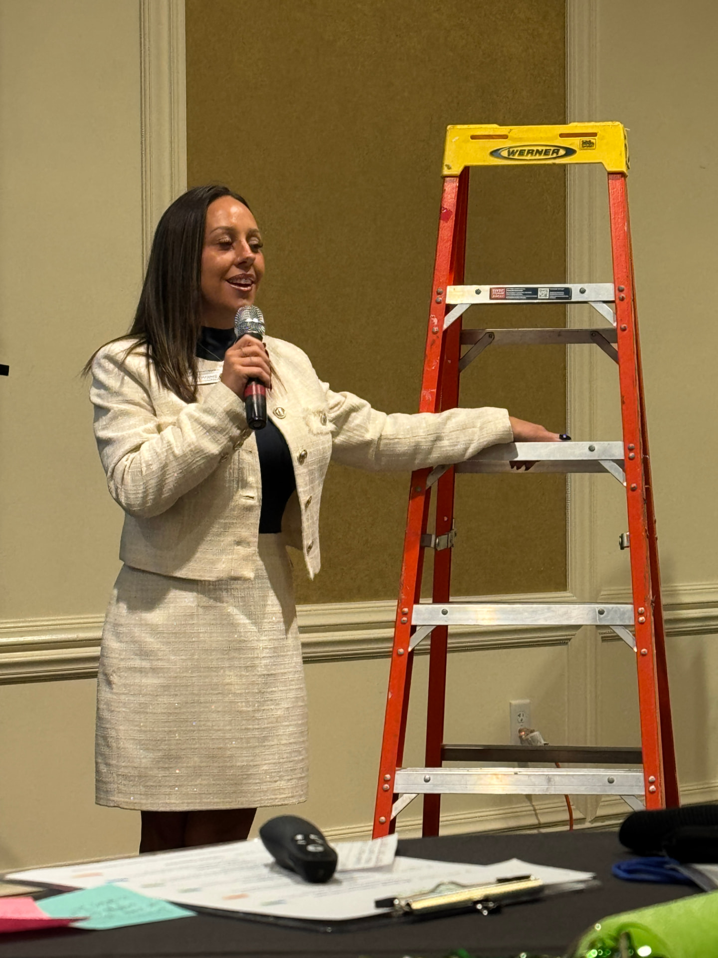 Speaker presenting beside a ladder during a SHIFT 2026 session