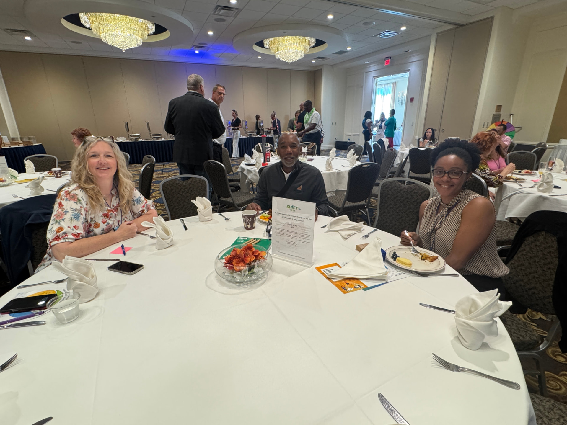 Attendees gathered around a table at SHIFT 2026 breakfast